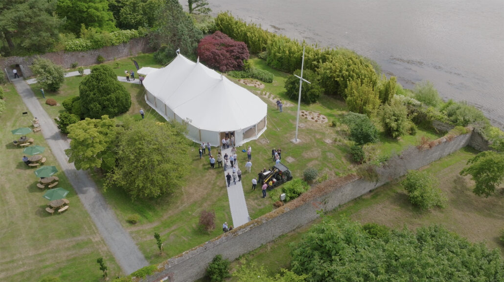 Aerial view of people mingling outside the marquee at brook hall