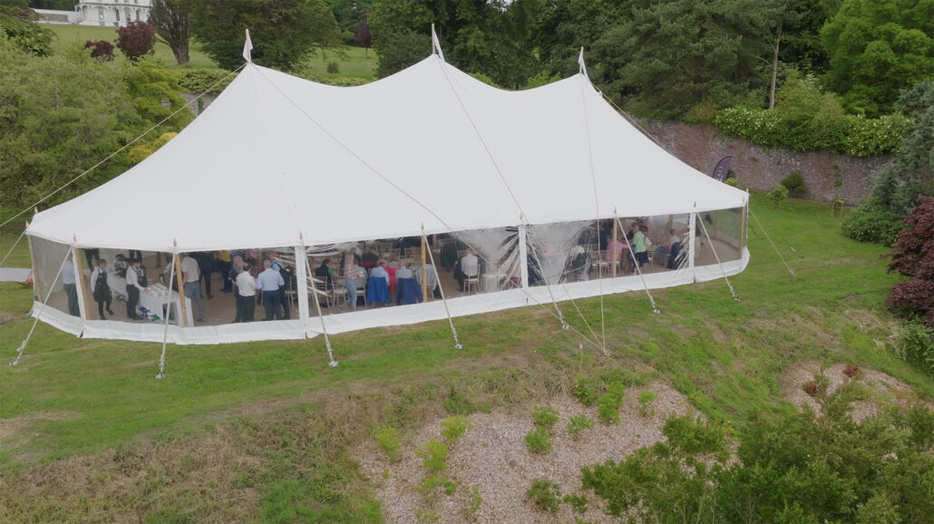 aerial view of an the marquee filled with peope enjoying a corporate event at brook hall